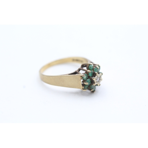 125 - 9ct gold emerald and diamond halo ring (2.8g) Size O