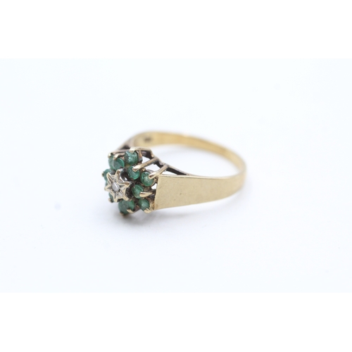 125 - 9ct gold emerald and diamond halo ring (2.8g) Size O