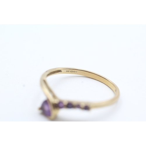 128 - 9ct gold amethyst twist ring (2g) Size U 1/2