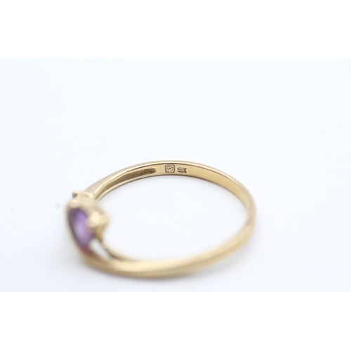 128 - 9ct gold amethyst twist ring (2g) Size U 1/2