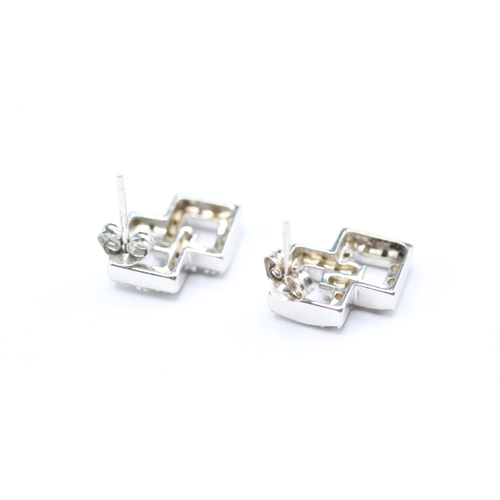 130 - 9ct gold and diamond stud earrings (2.9g)