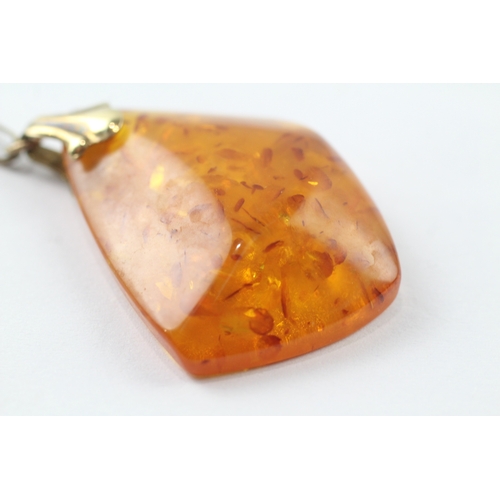 131 - 8ct gold amber pendant on 9ct chain (9.1g)