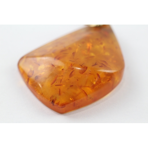 131 - 8ct gold amber pendant on 9ct chain (9.1g)