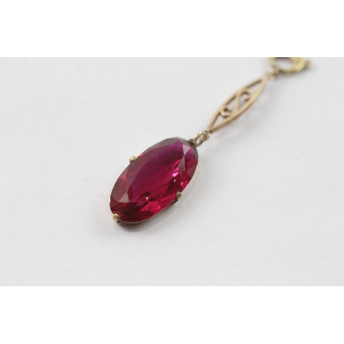 133 - 9ct gold oval cut red gemstone drop pendant