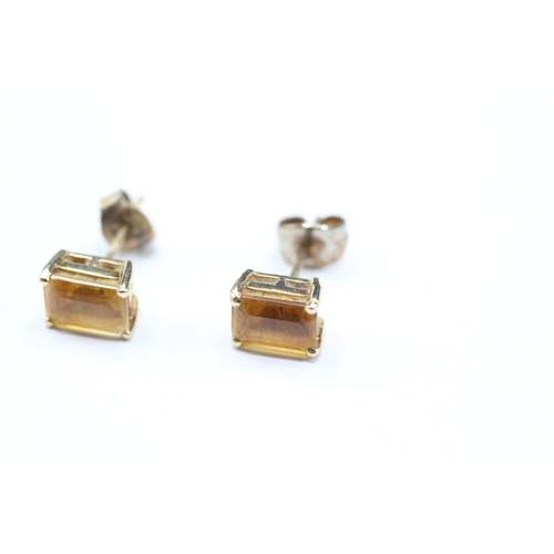 144 - 9ct gold orange gemstone stud earrings (1.5g)