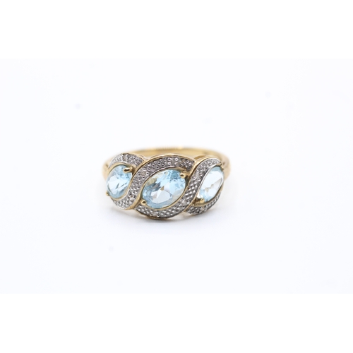 146 - 9ct gold blue gemstone and diamond ring (2.6g) Size P 1/2