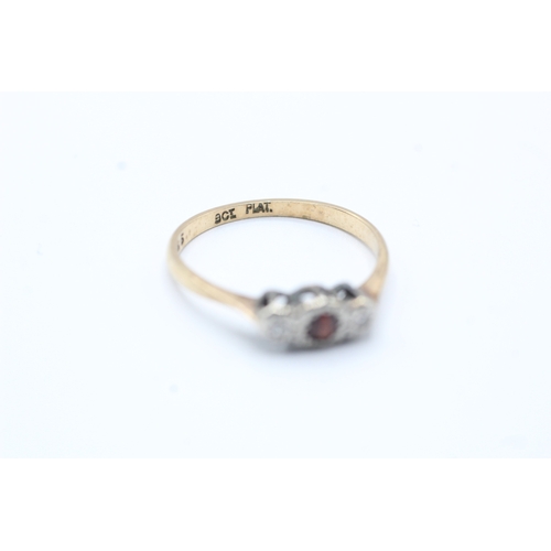 148 - 9ct gold diamond and red gemstone ring (1.4g) Size O