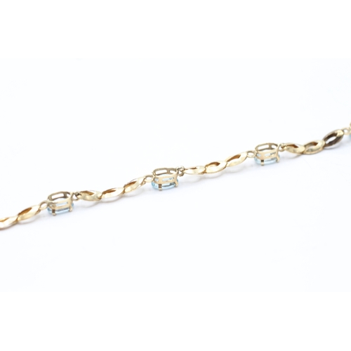 180 - 9ct gold and blue gemstone bracelet (2.5g)