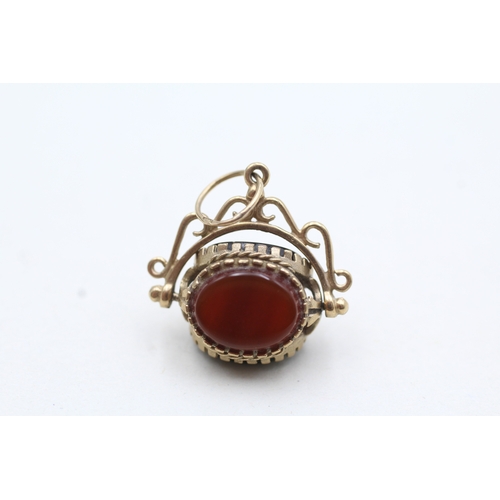 188 - 9ct gold vintage black onyx, bloodstone & carnelian spinning fob (2.5g)