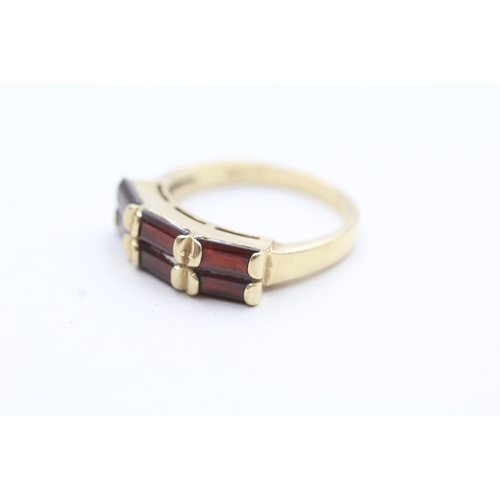 191 - 14ct gold red gemstone dress ring (4.7g) Size R