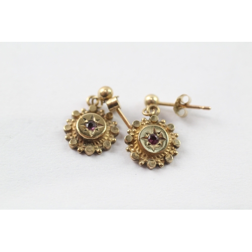 194 - 2 x 9ct gold ruby and diamond scroll back earrings (2.2g)