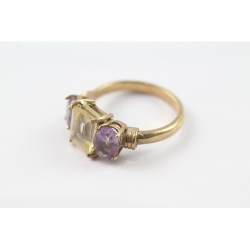 215 - 9ct gold amethyst and yellow gemstone trilogy ring (4.4g) Size P 1/2