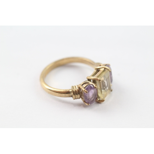 215 - 9ct gold amethyst and yellow gemstone trilogy ring (4.4g) Size P 1/2