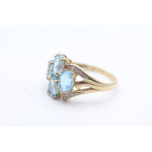 240 - 9ct gold diamond and topaz four stone ring (3.5g) Size P