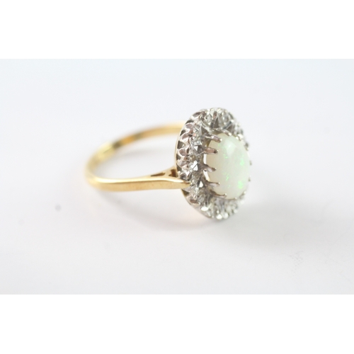 26 - 18ct gold opal and diamond halo dress ring (4.7g) Size M 1/2