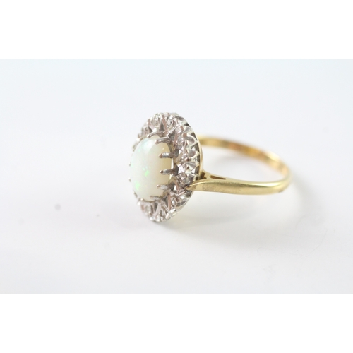 26 - 18ct gold opal and diamond halo dress ring (4.7g) Size M 1/2