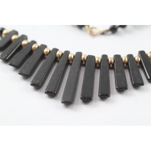 37 - 9ct gold black gemstone necklace (14.4g)