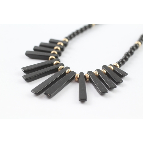 37 - 9ct gold black gemstone necklace (14.4g)