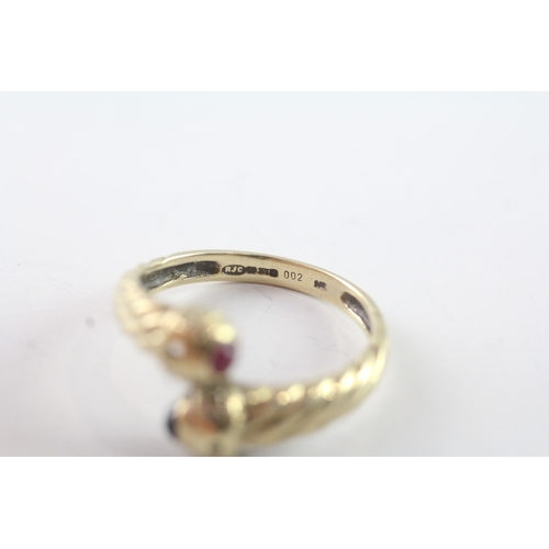 39 - 9ct gold ruby and sapphire bypass dress ring (2.4g) Size P