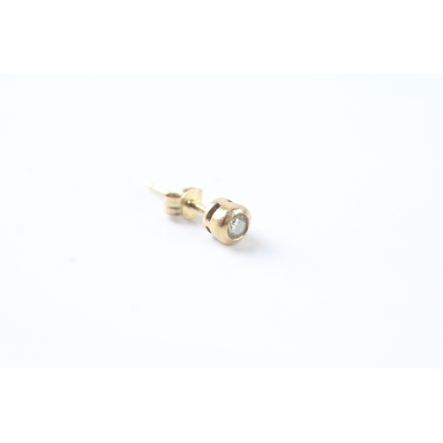 47 - 9ct gold bezel set diamond stud earrings (1g)