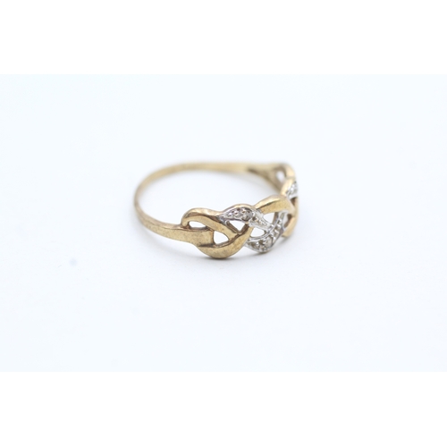 52 - 9ct gold diamond twist ring (1.1g) Size K