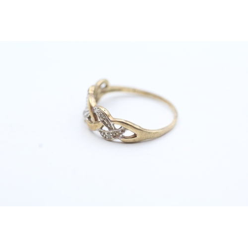 52 - 9ct gold diamond twist ring (1.1g) Size K