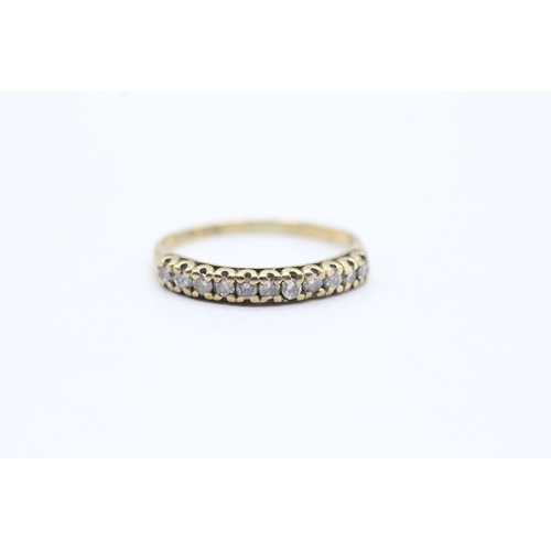 62 - 9ct gold row set diamond ring (1.2g) Size L