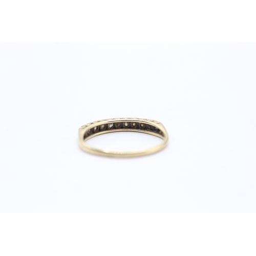 62 - 9ct gold row set diamond ring (1.2g) Size L