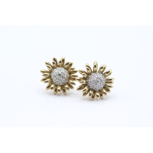 64 - 9ct gold diamond sunflower stud earrings (3.4g)