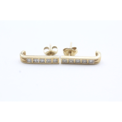 73 - 9ct gold diamond bar stud earrings (1.5g)