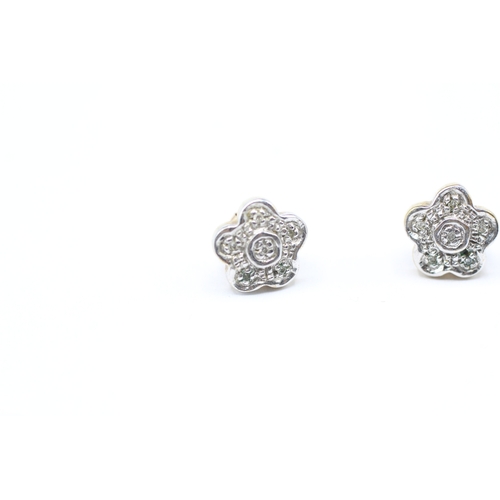 91 - 9ct gold and diamond flower shape stud earrings (1.4g)