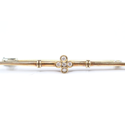 93 - 14ct gold diamond set bar brooch (2.6g)