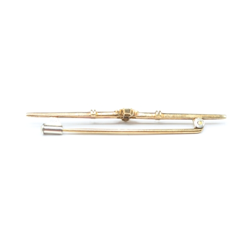 93 - 14ct gold diamond set bar brooch (2.6g)