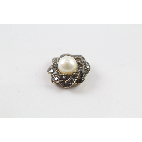 106 - 9ct gold diamond and pearl pendant