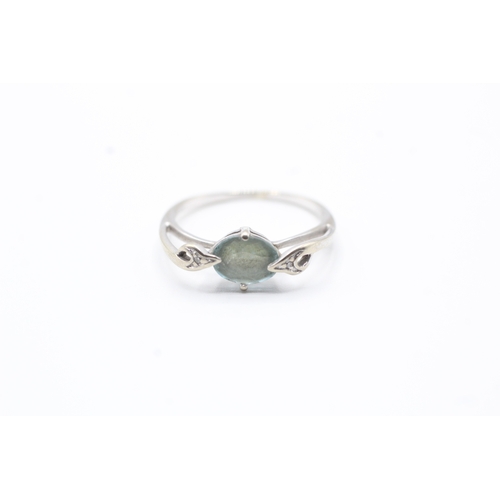 122 - 9ct gold blue gemstone and diamond ring (2.2g) Size Q 1/2