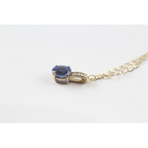 144 - 9ct gold diamond and blue gemstone pendant on chain