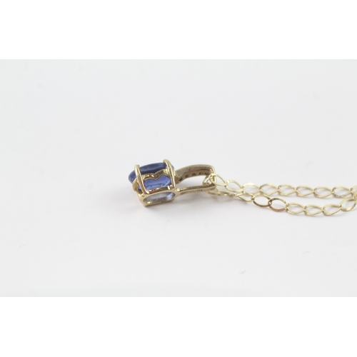 144 - 9ct gold diamond and blue gemstone pendant on chain