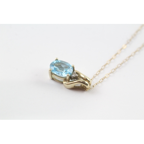 150 - 9ct gold blue gemstone and diamond pendant on chain