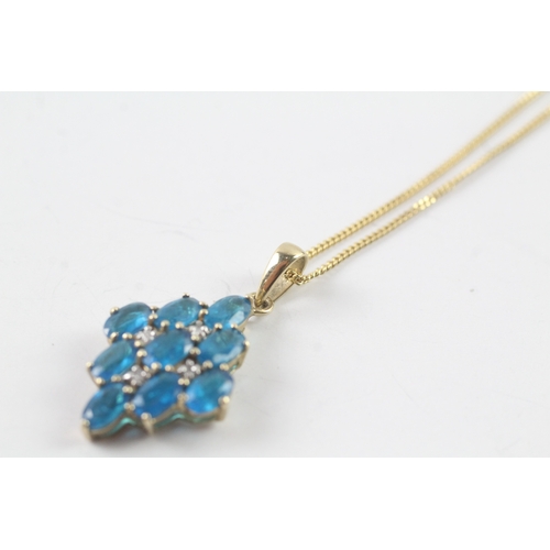 172 - 9ct gold diamond and blue gemstone pendant on chain