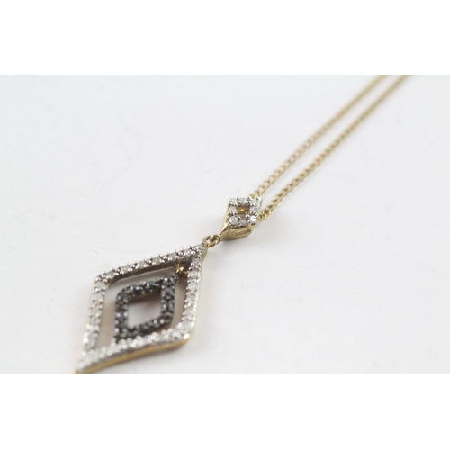 176 - 9ct gold 'black gemstone & diamond pendant necklaces