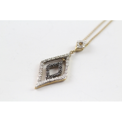 176 - 9ct gold 'black gemstone & diamond pendant necklaces