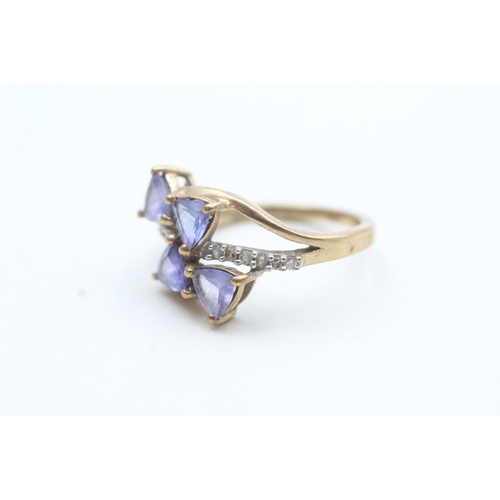 179 - 9ct gold diamond and tanzanite twist ring (3.5g) Size N 1/2