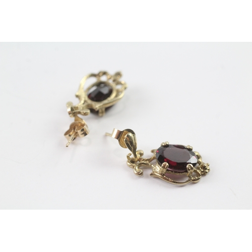 29 - 9ct gold garnet drop stud earrings