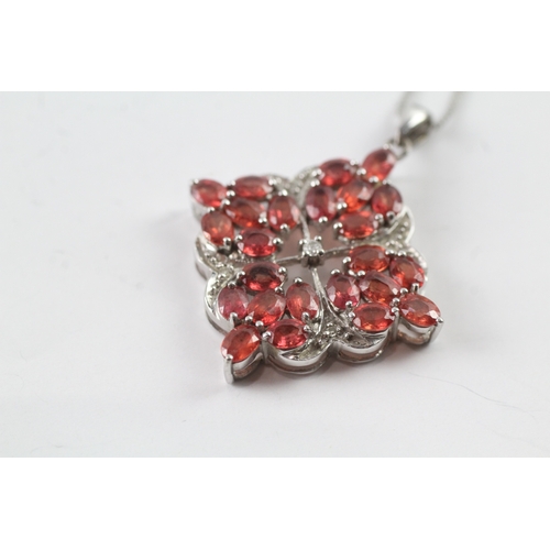 48 - 9ct gold diamond and red gemstone pendant on chain