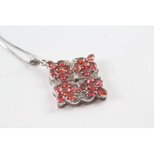 48 - 9ct gold diamond and red gemstone pendant on chain