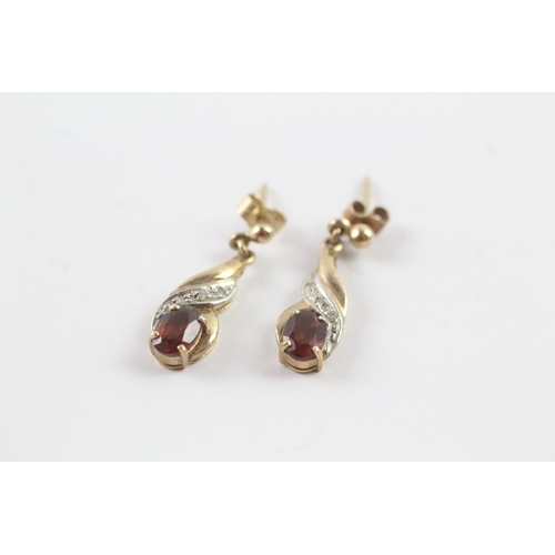 57 - 9ct gold garnet and diamond drop stud earrings