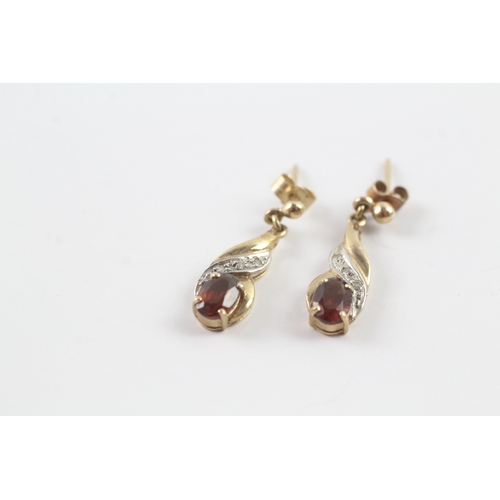 57 - 9ct gold garnet and diamond drop stud earrings