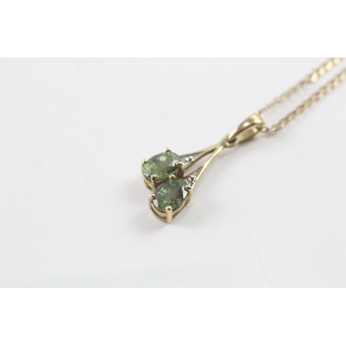 62 - 9ct gold diamond and green gemstone pendant on chain