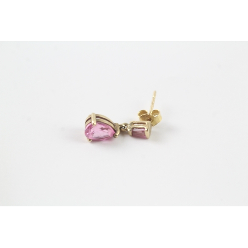 63 - 9ct gold pink gemstone drop stud earrings