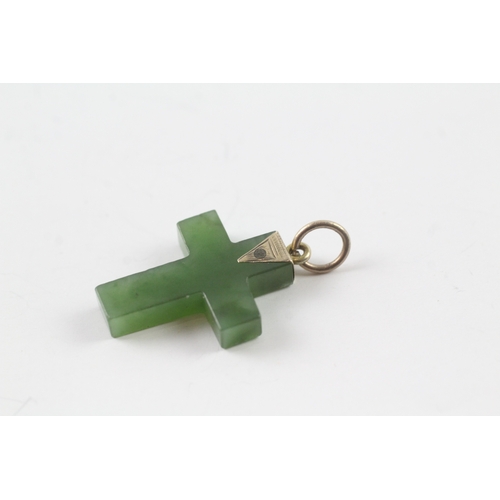 64 - 9ct gold nephrite cross pendant